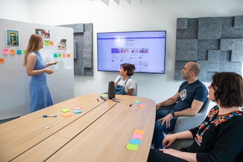 a group of people sitting around a conference table