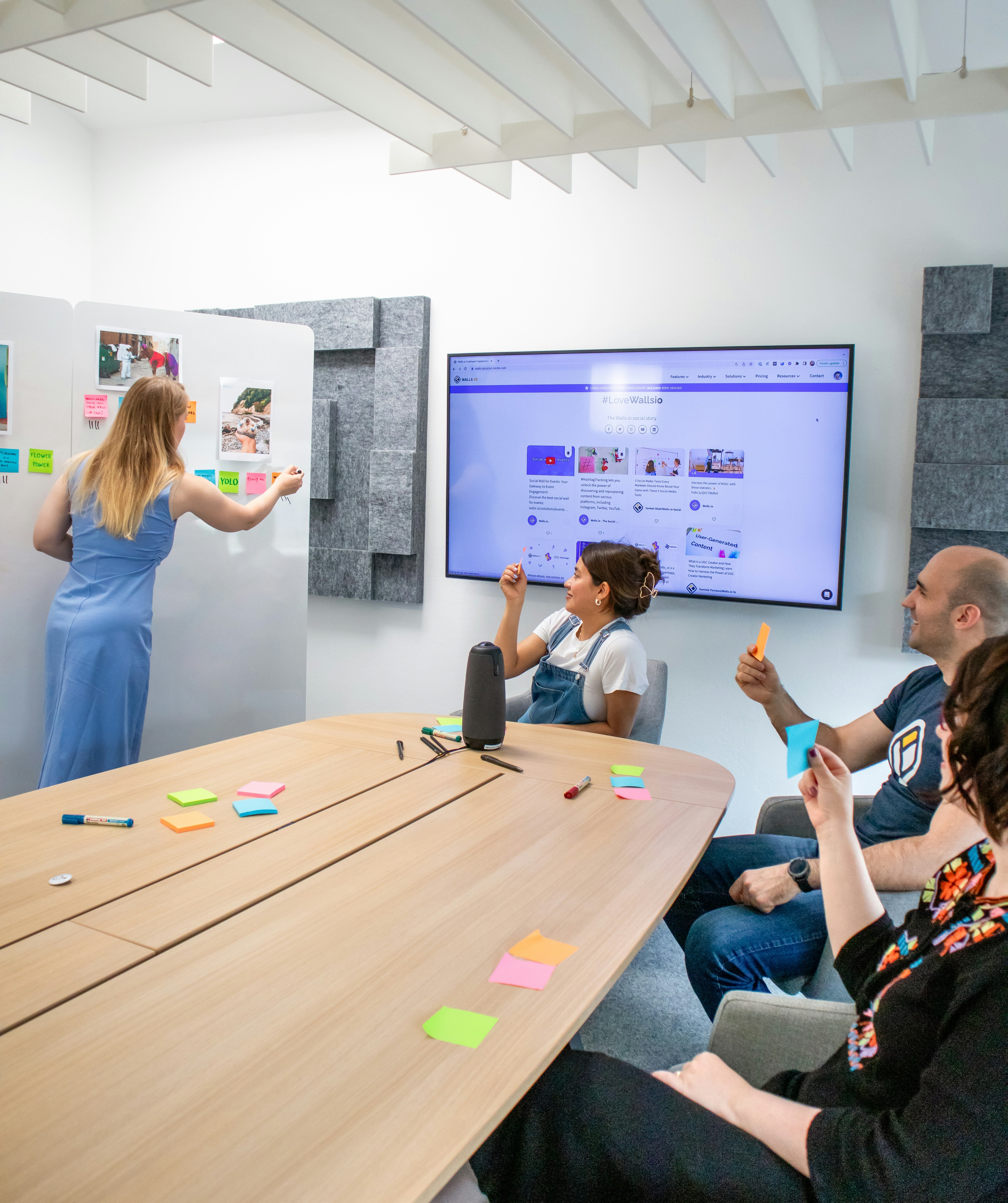 a group of people sitting around a wooden table