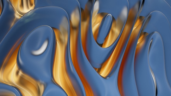Smooth, fluid-like metallic surface with swirling patterns of blue and gold hues. The surface reflects light, creating an almost liquid appearance with soft highlights.