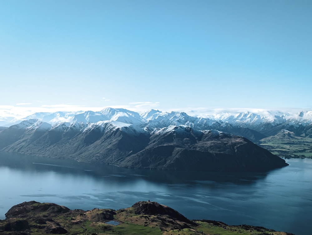 a view of a lake and mountains from a high point of view