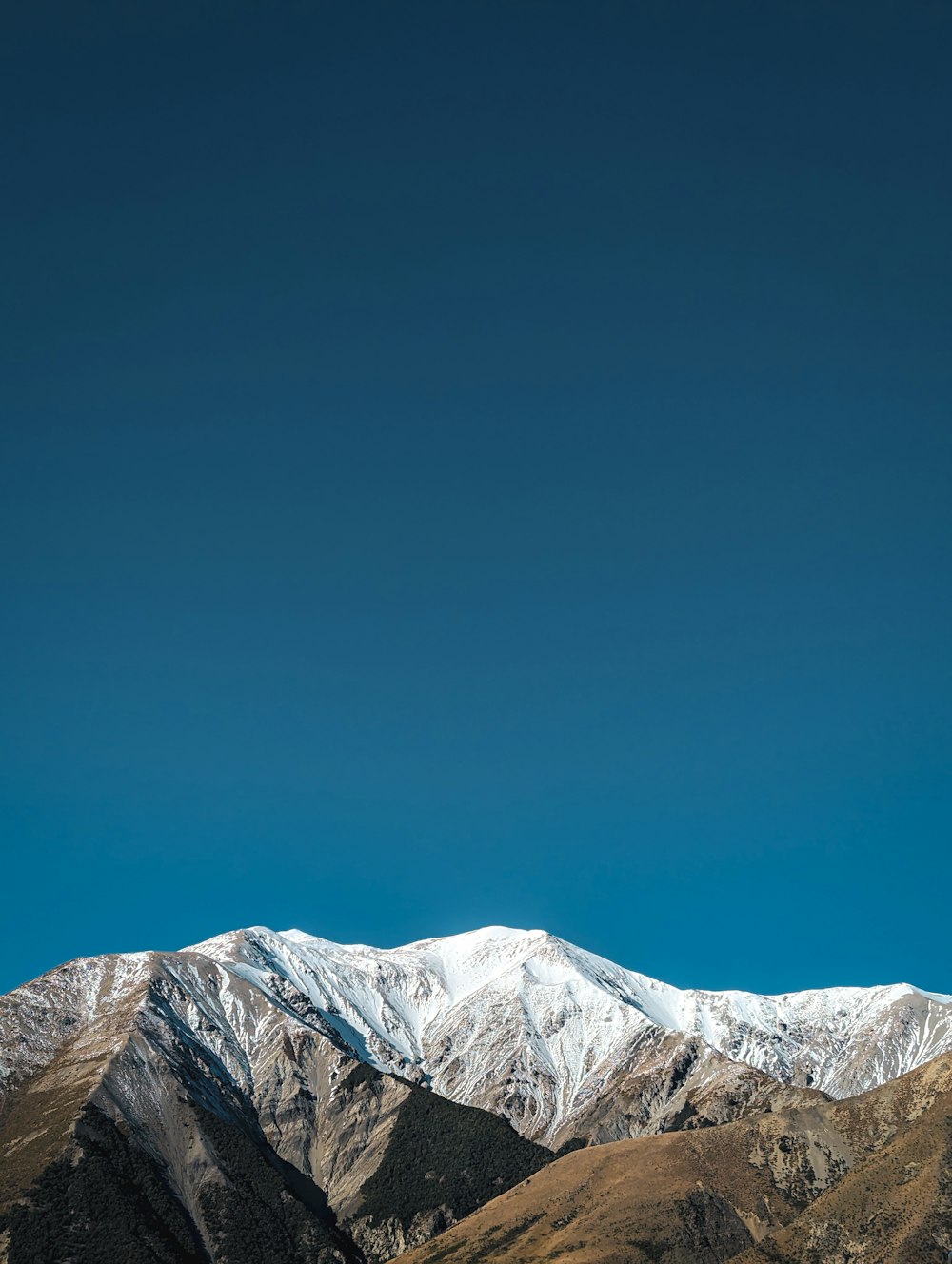 a view of a snow covered mountain range