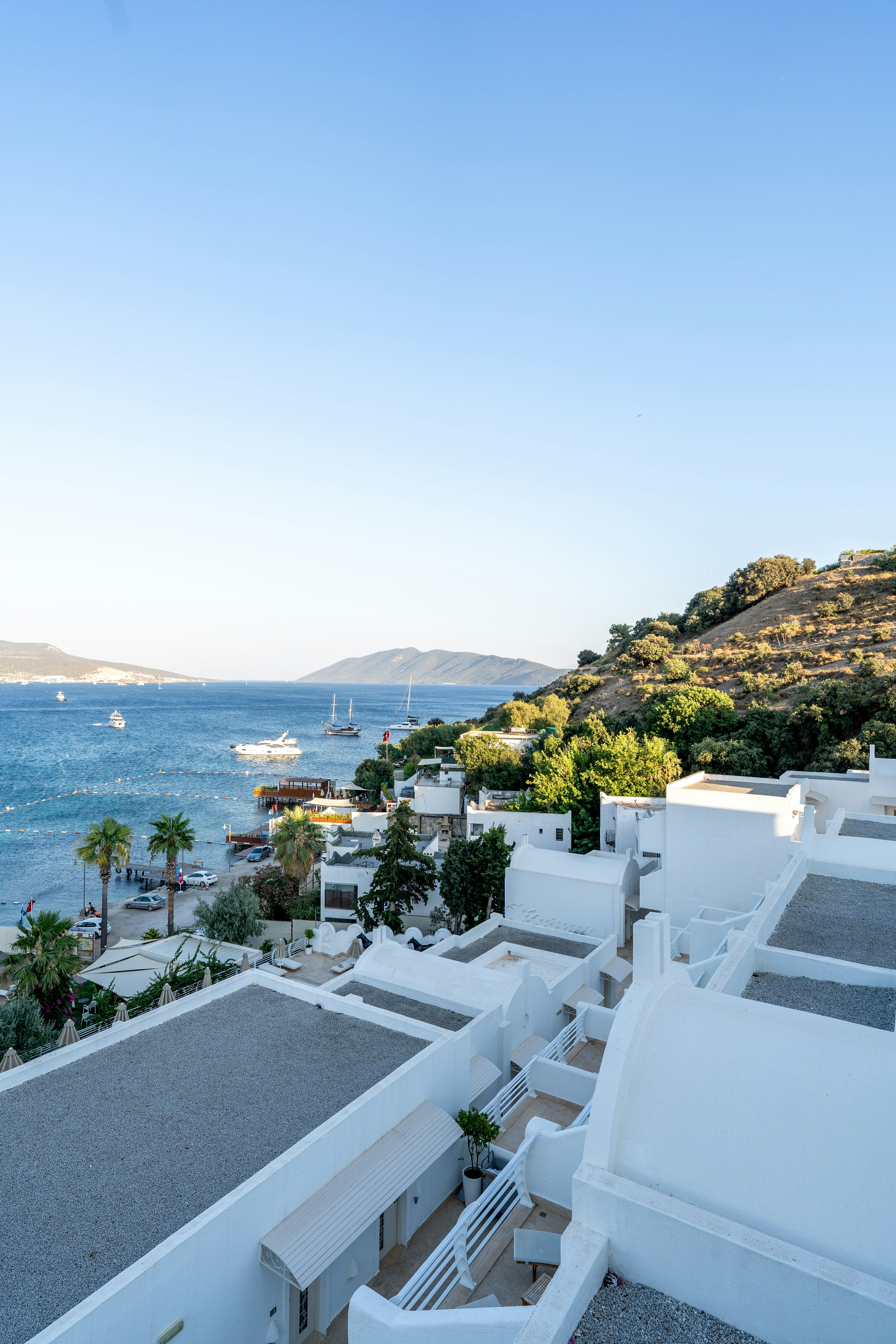 a view of the ocean from a rooftop of a building - a-view-of-the-ocean-from-a-rooftop-of-a-building-nmp-GAALqKA