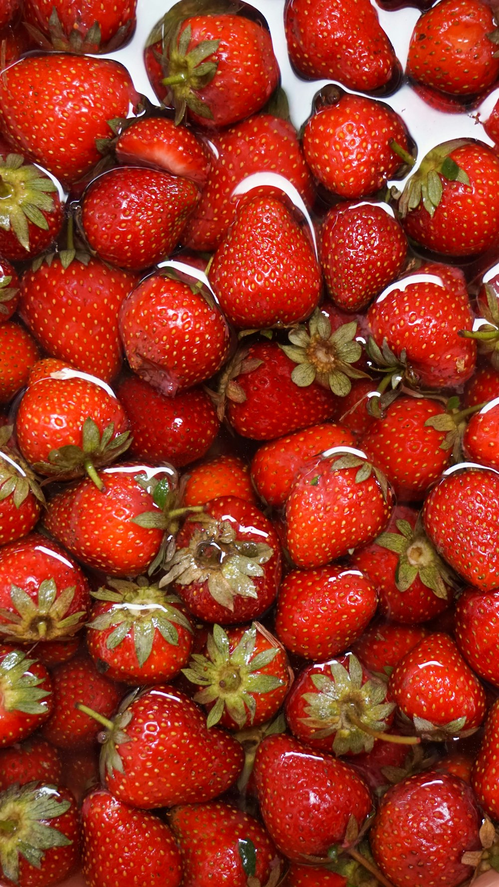 a bunch of strawberries are in a bowl