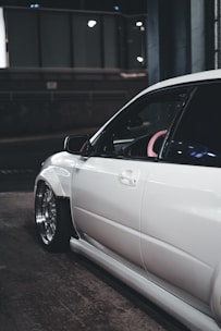 a white car parked in a parking garage