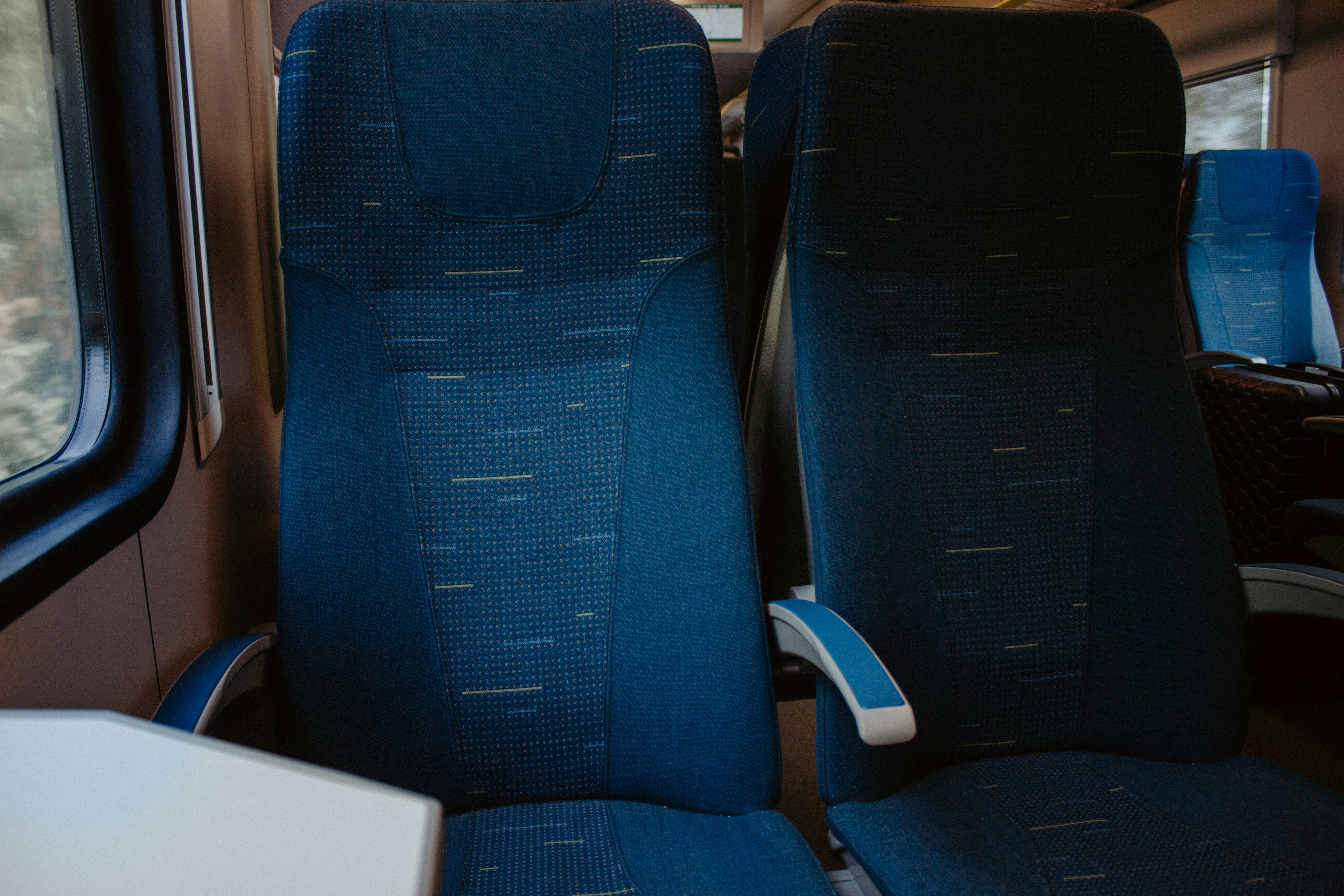 the seats on the train are blue