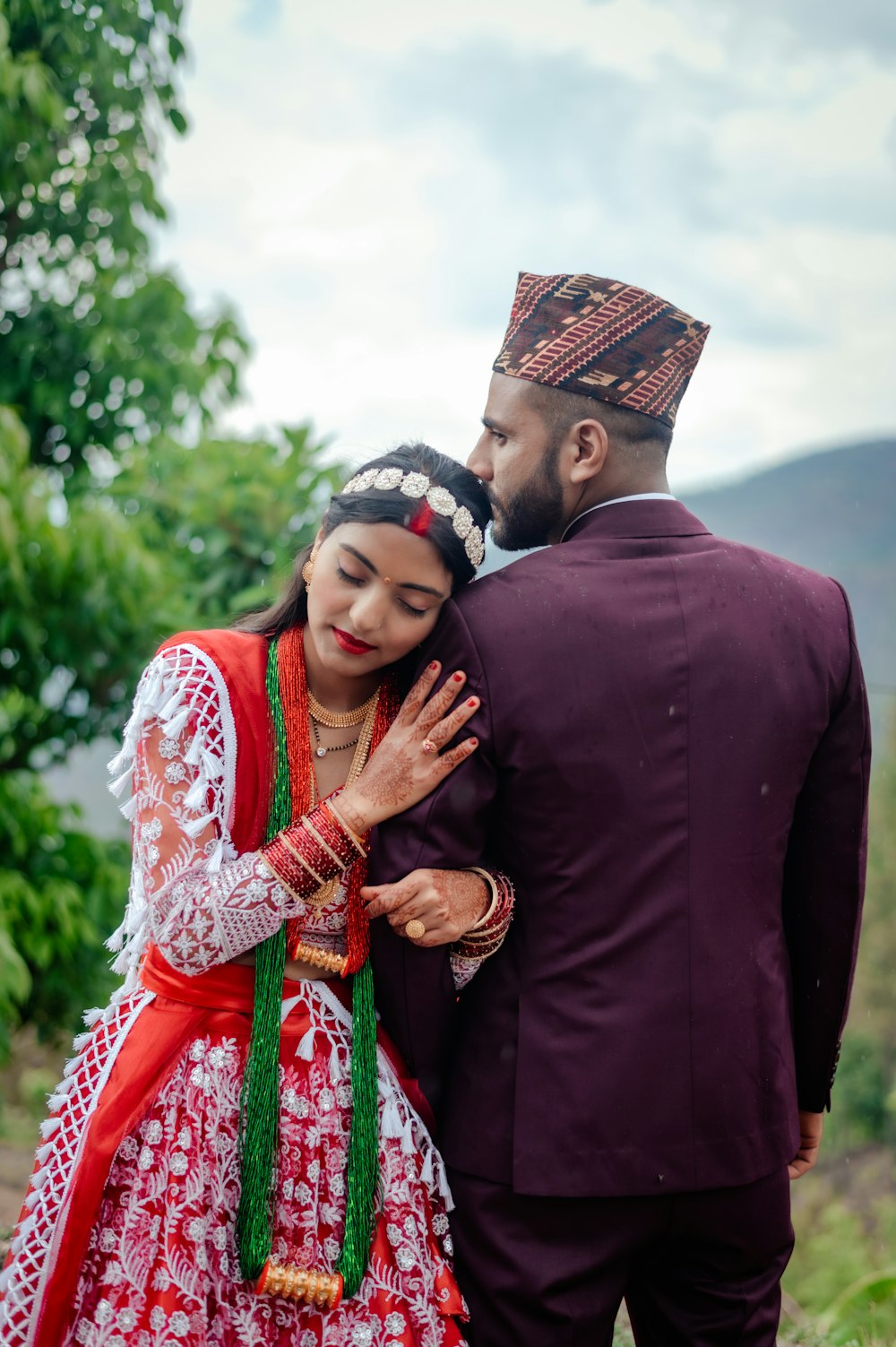 a man and woman dressed in traditional indian garb