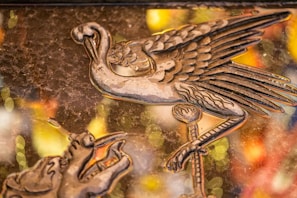 A delicate ink sketch of a Renaissance-style mechanical bird on aged parchment.