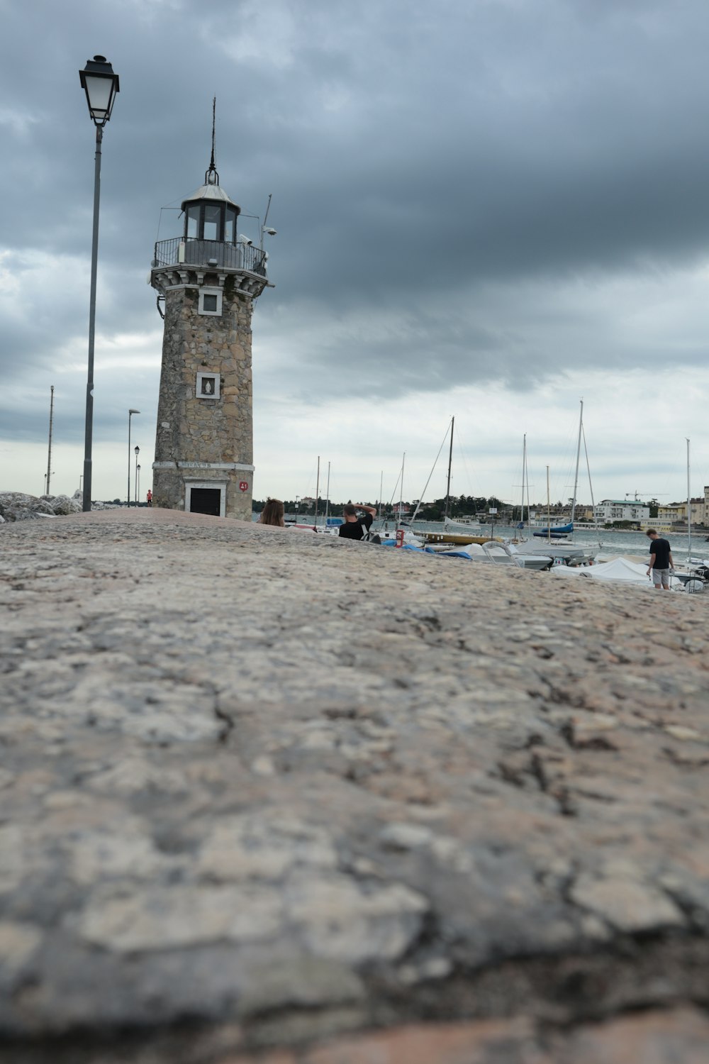 a light house sitting on top of a rocky beach