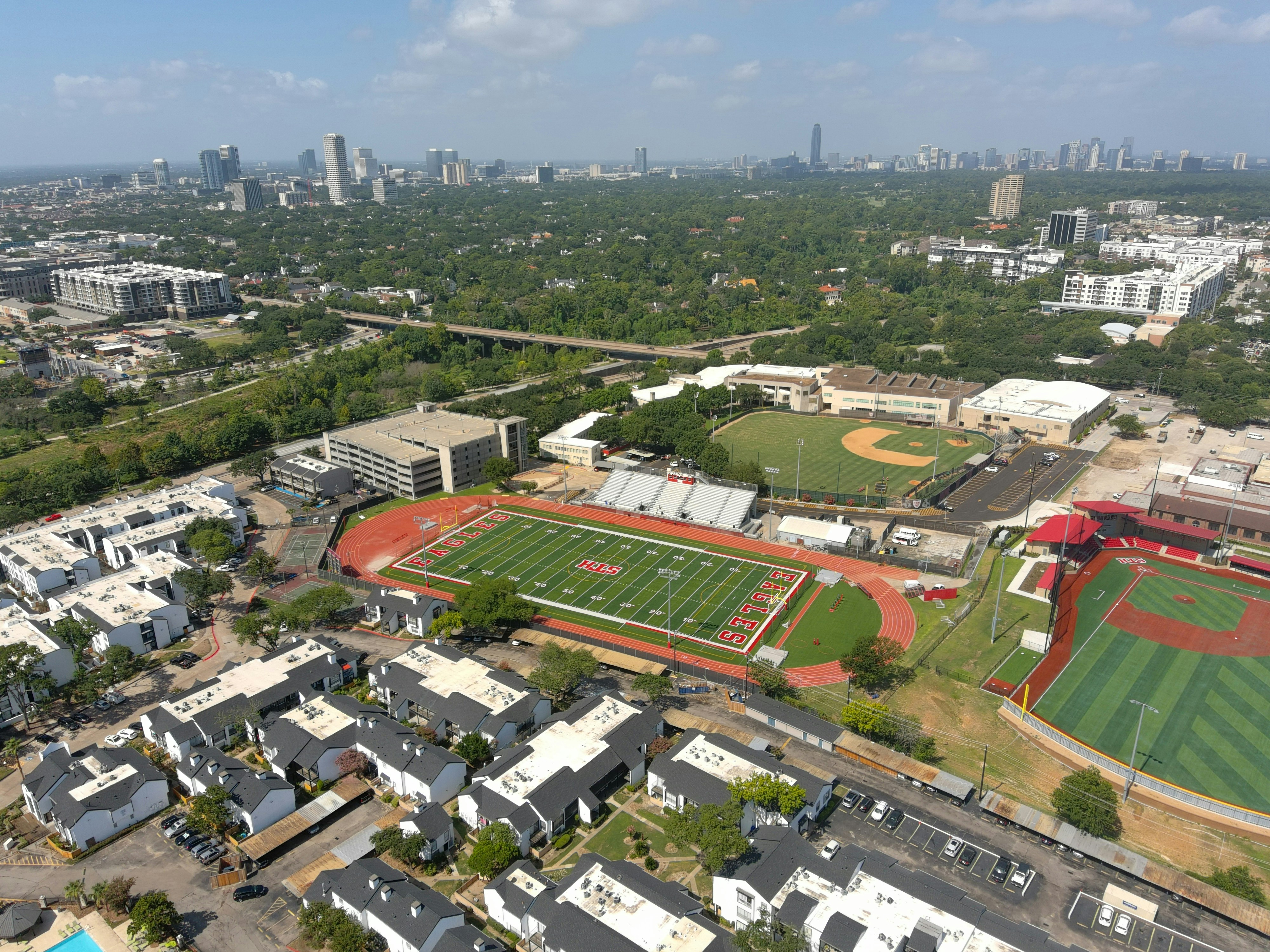 an aerial view of a baseball field in a city