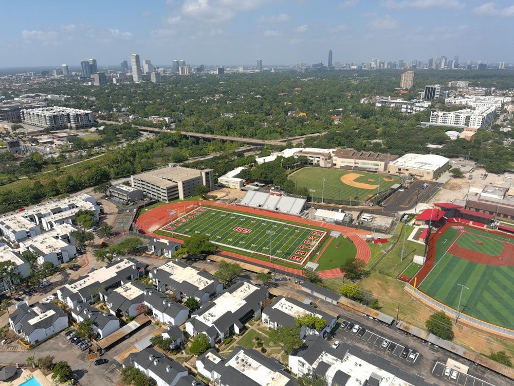 an aerial view of a baseball field in a city