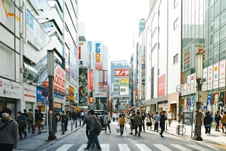 A vibrant street scene showing diverse men and women confidently wearing stylish, casual outfits.
