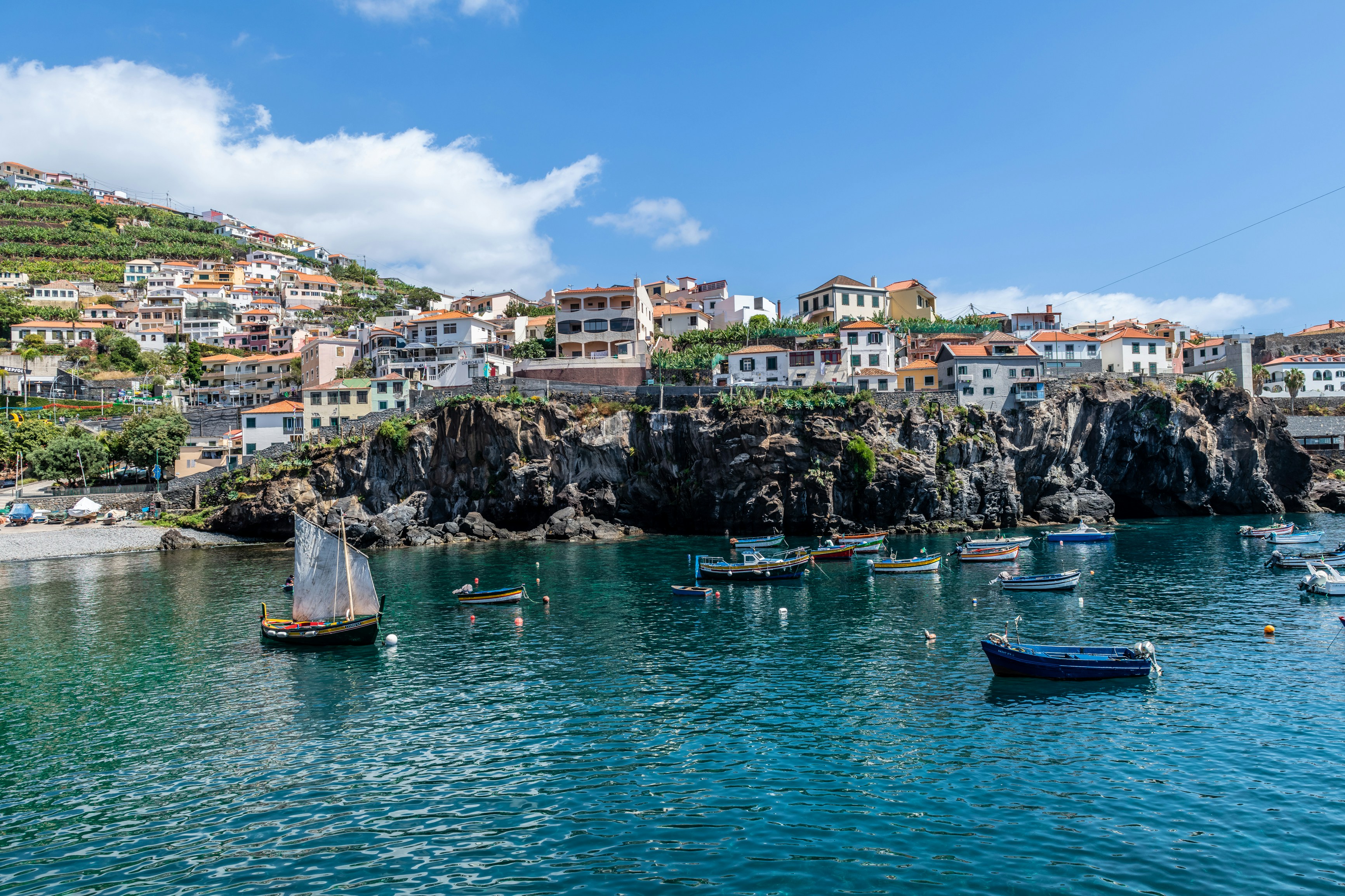a group of boats floating on top of a body of water