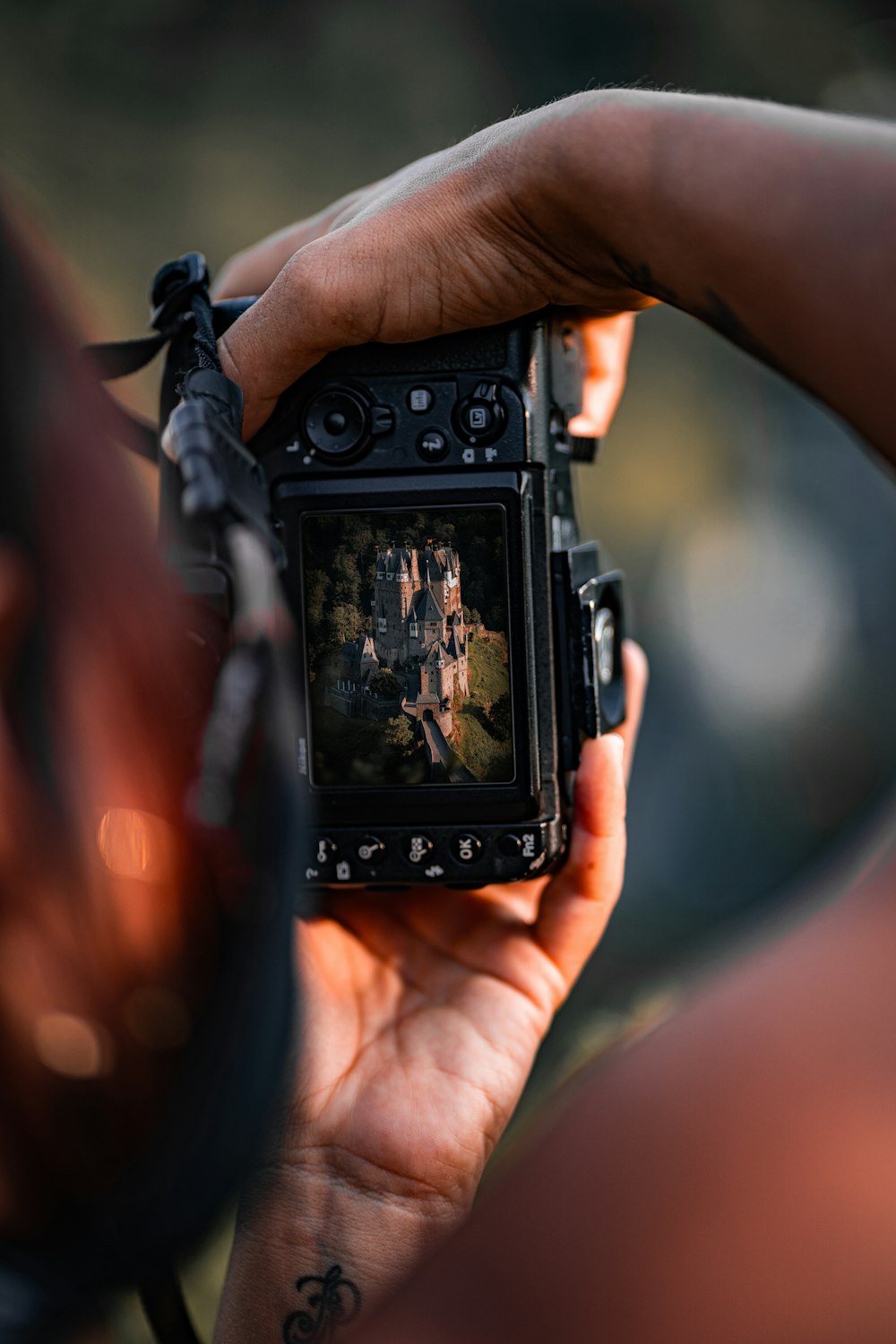 a person holding a camera up to take a picture