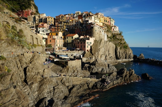 a village on a cliff overlooking the ocean