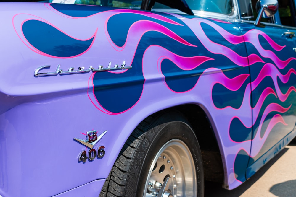 a close up of a purple and blue truck