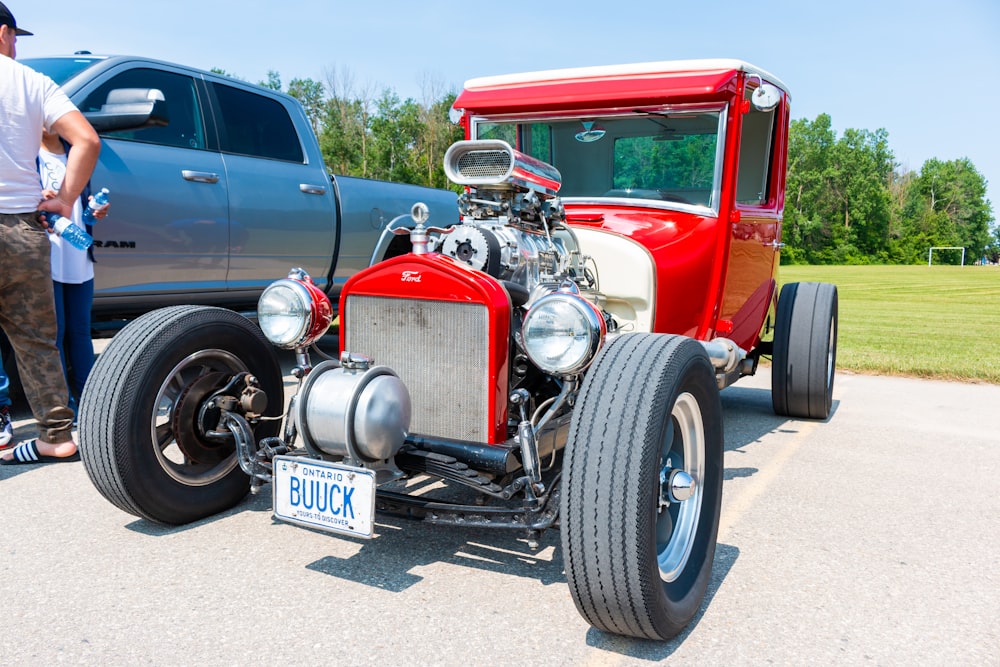 a red truck parked next to a silver truck