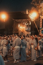 a group of people dressed in traditional japanese clothing