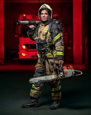 A firefighter wearing full gear holding a shiny fire axe against a smoky backdrop