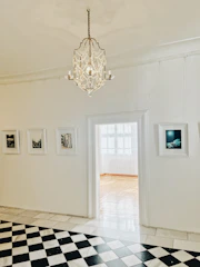 A well-lit room with finished drywall and elegant lighting.