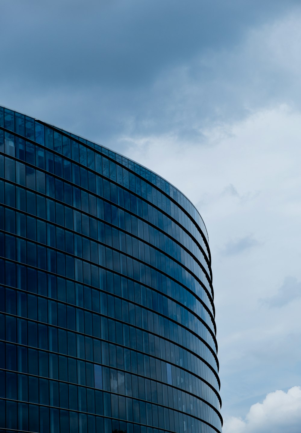 a tall building with a sky in the background