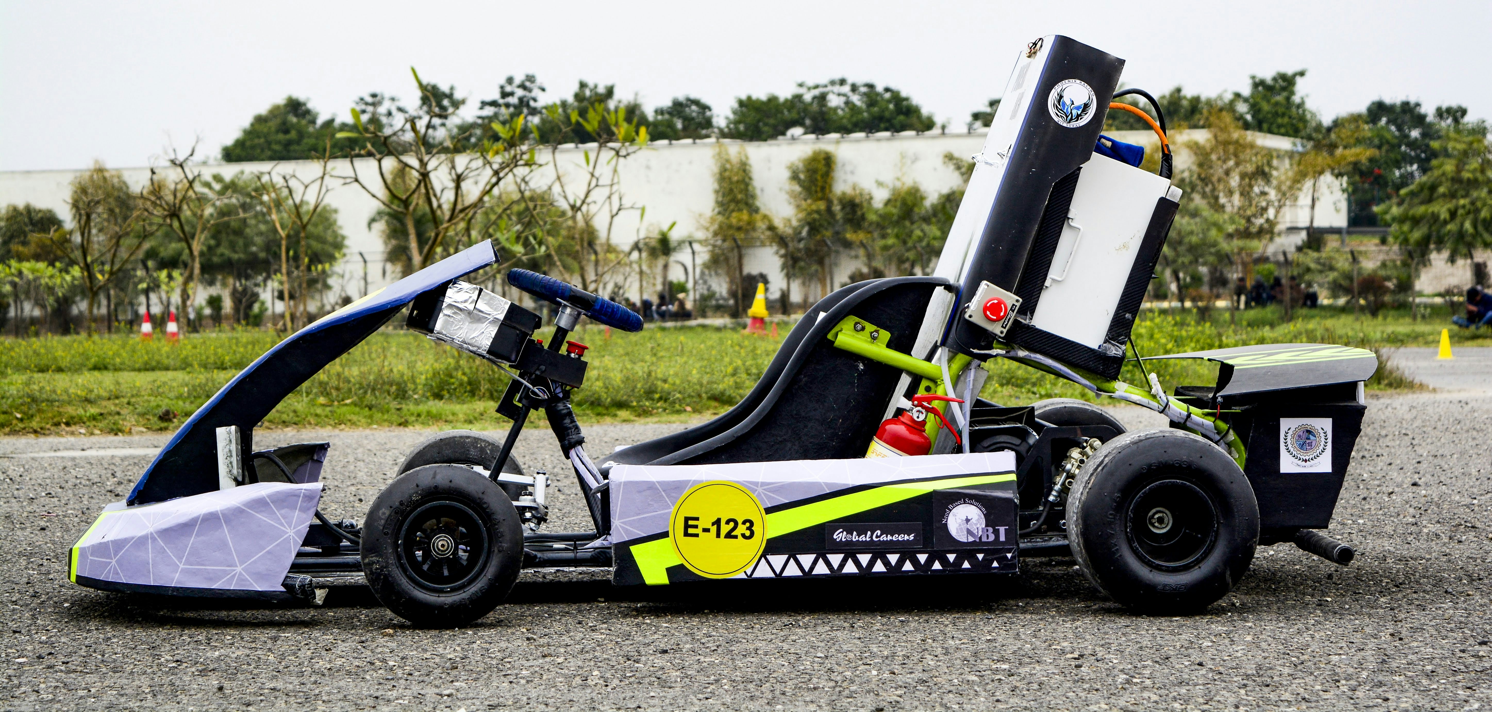 A go kart is parked on the side of the road photo – Free Kart Image on ...