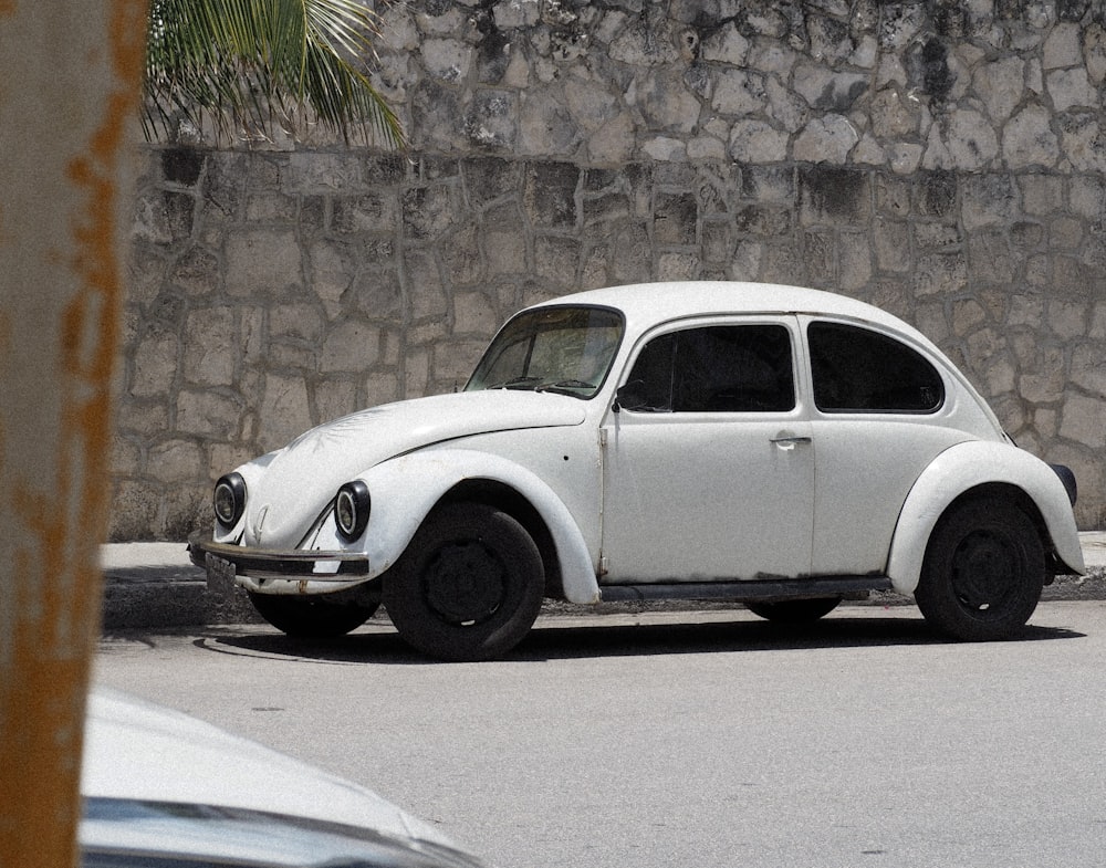 a white car parked on the side of the road