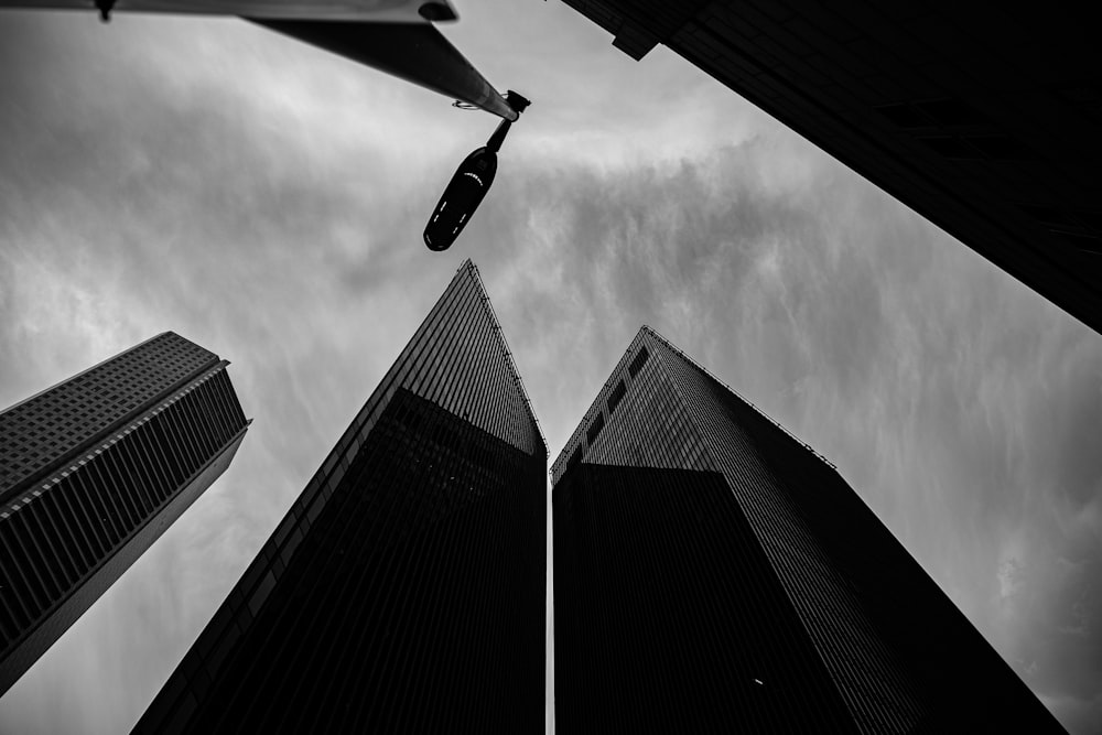 a black and white photo of tall buildings