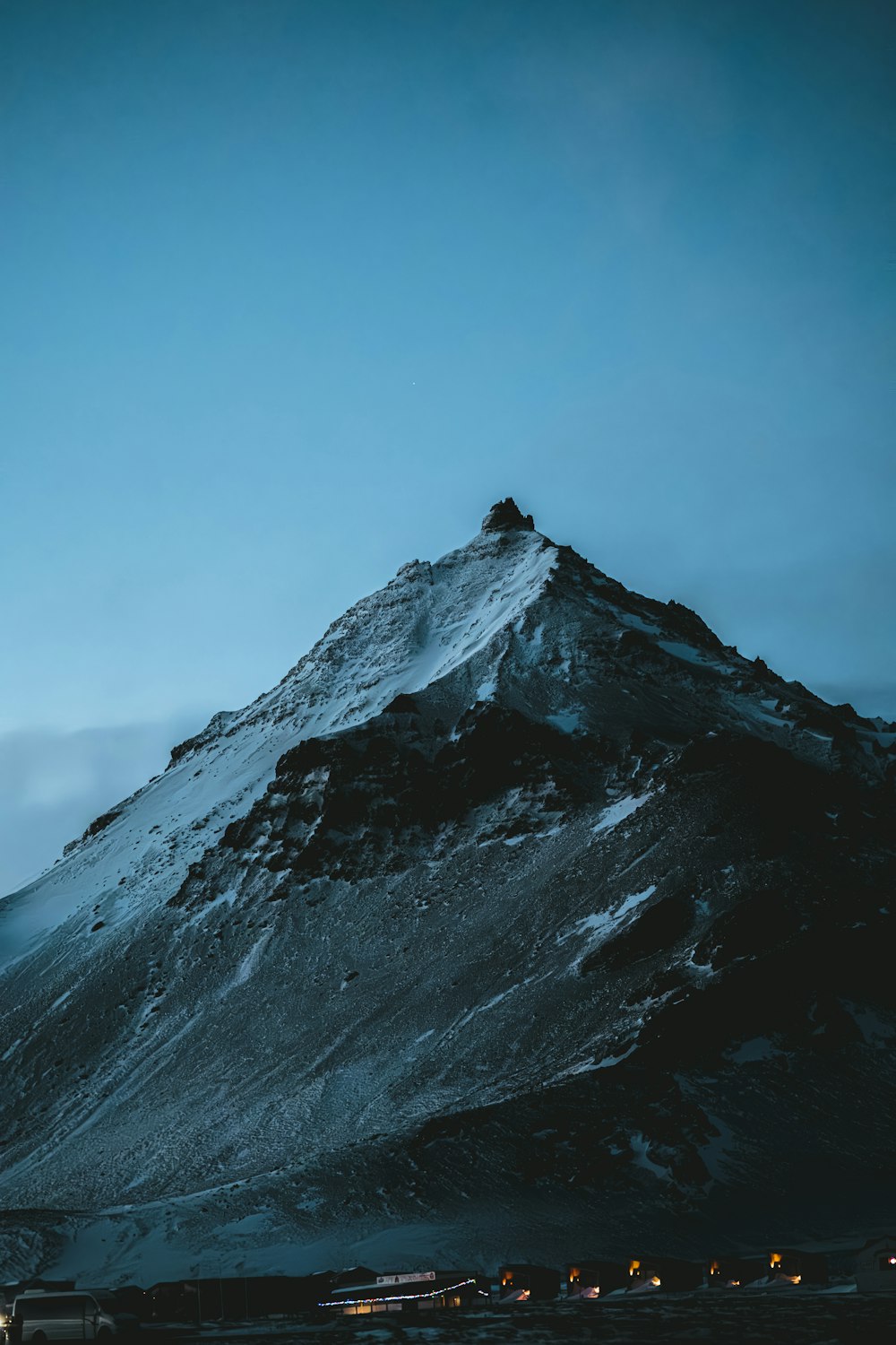 a snow covered mountain with a sky background