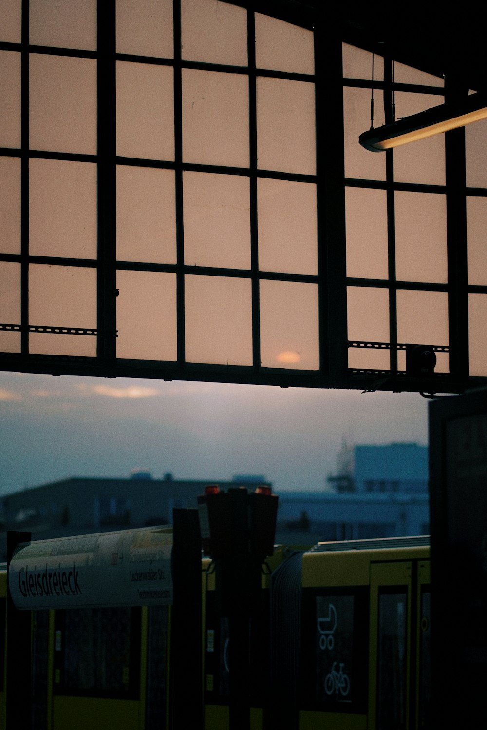 a view of a train station through a window