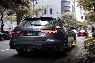 Image of a sleek car equipped with our 360 degree bird's-eye view system on a city street.