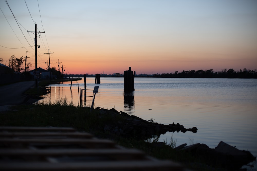 a body of water with a dock in the middle of it