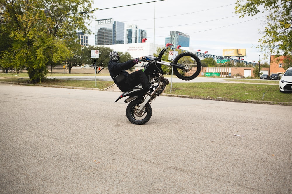 a person doing a trick on a motorcycle