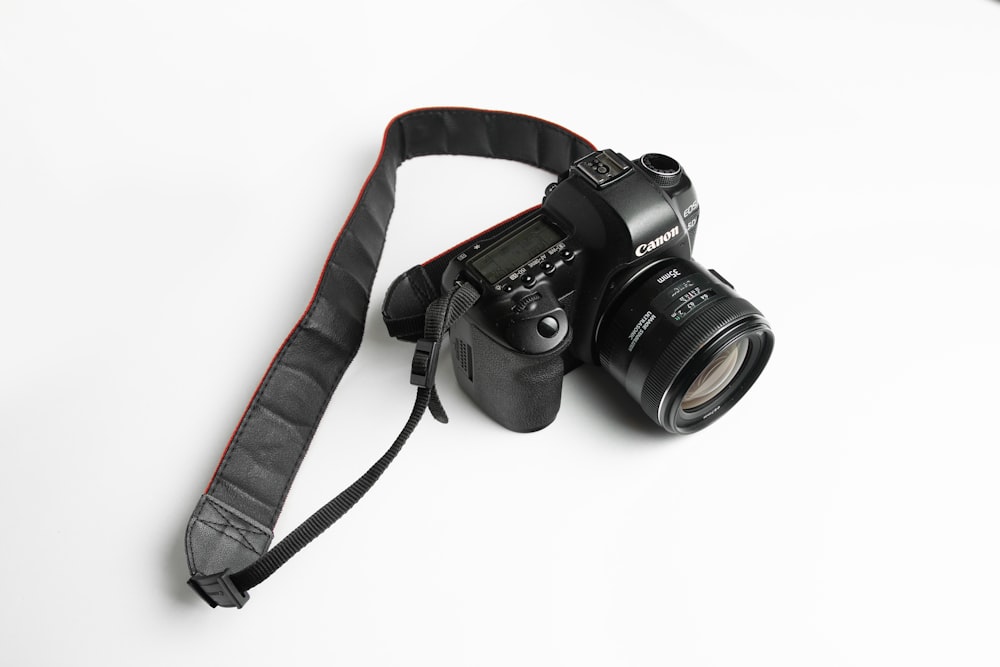 a camera with a strap attached to it