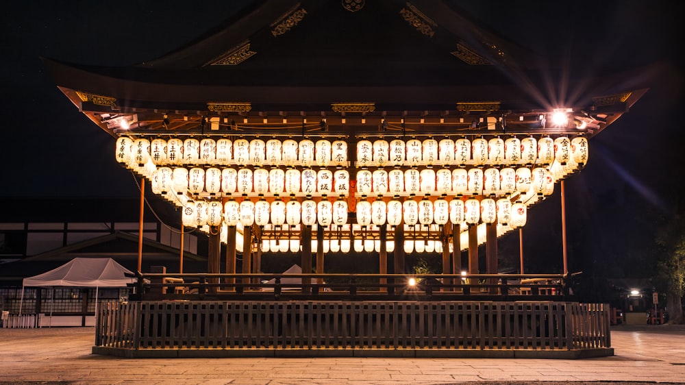 a large building with lights on top of it