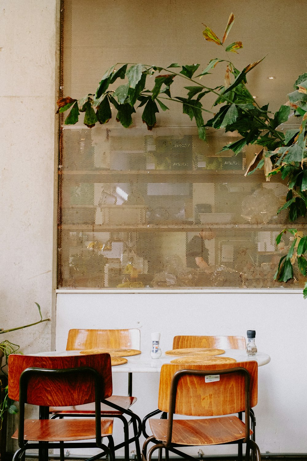 a couple of wooden chairs sitting next to each other