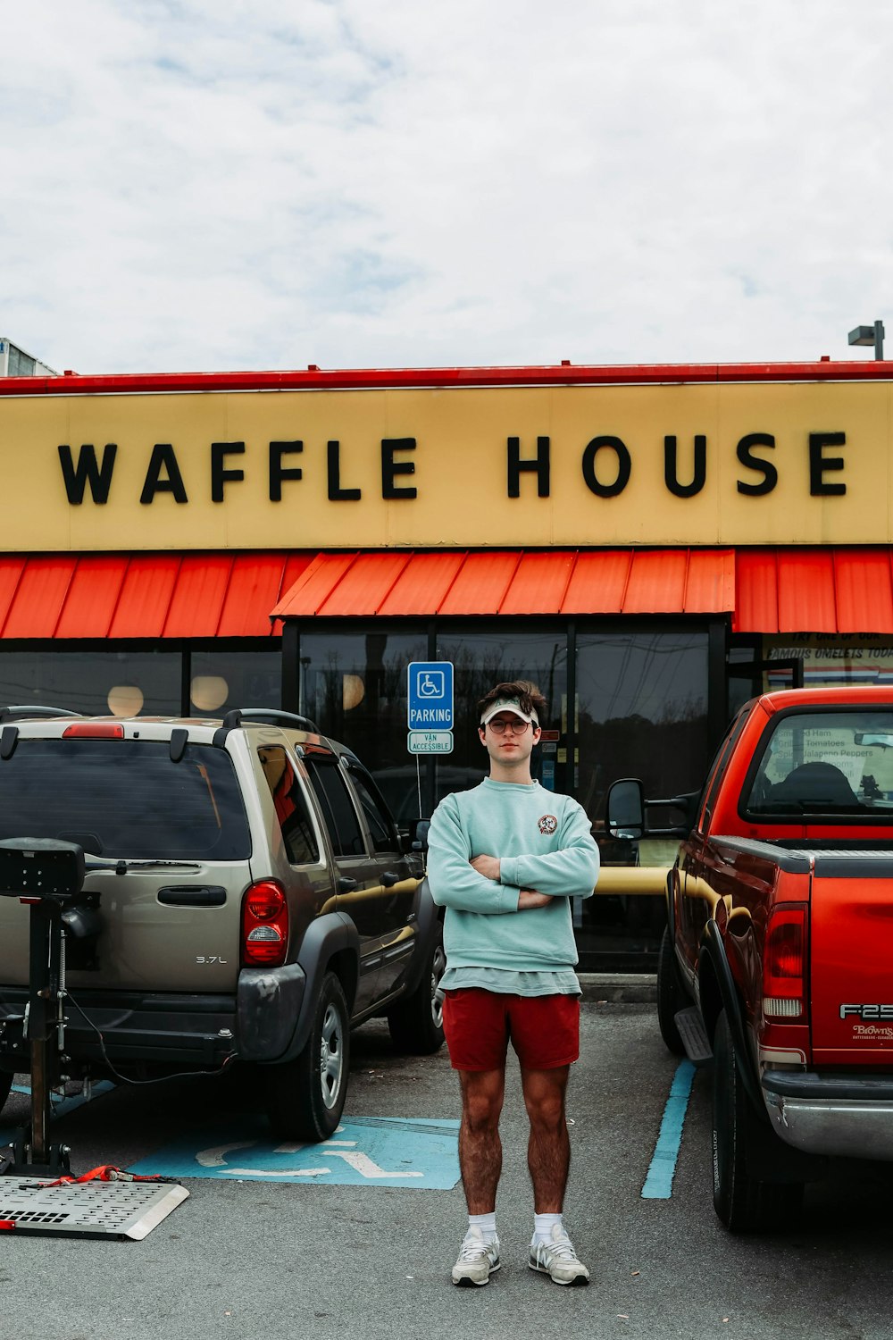 a woman standing in front of a waffle house