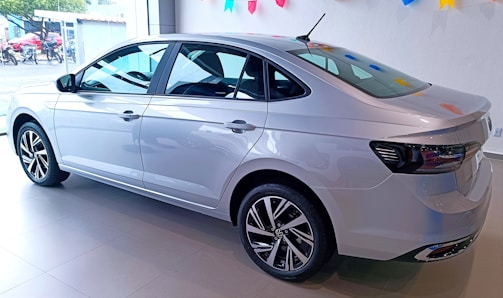 A stylish sedan parked in a showroom.