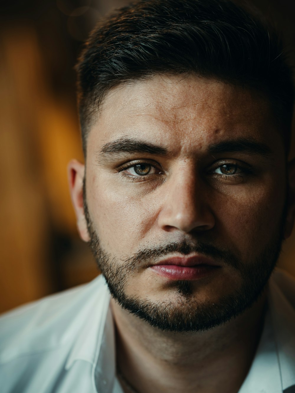 a close up of a person wearing a shirt and tie