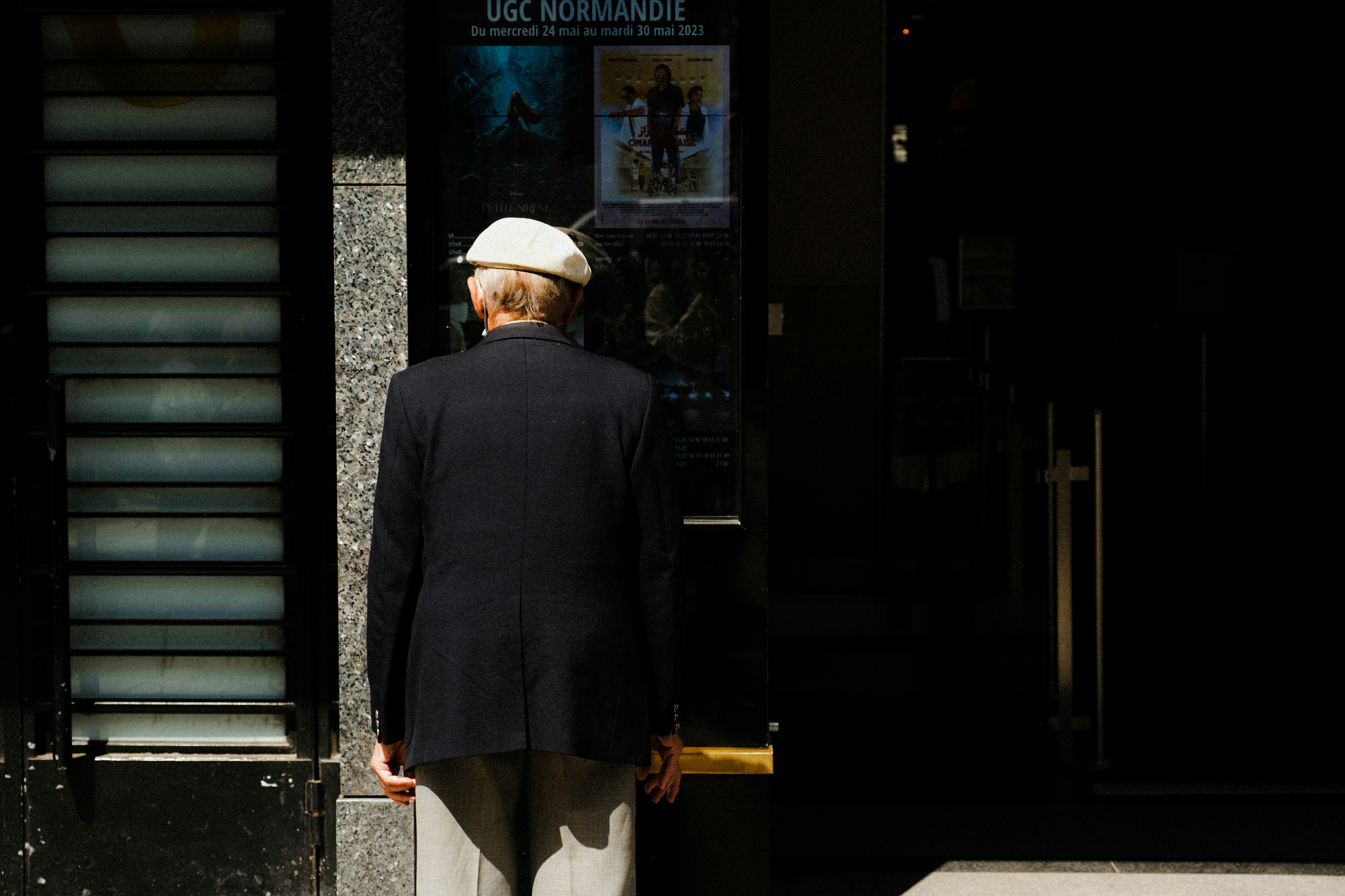 a man standing in front of a building