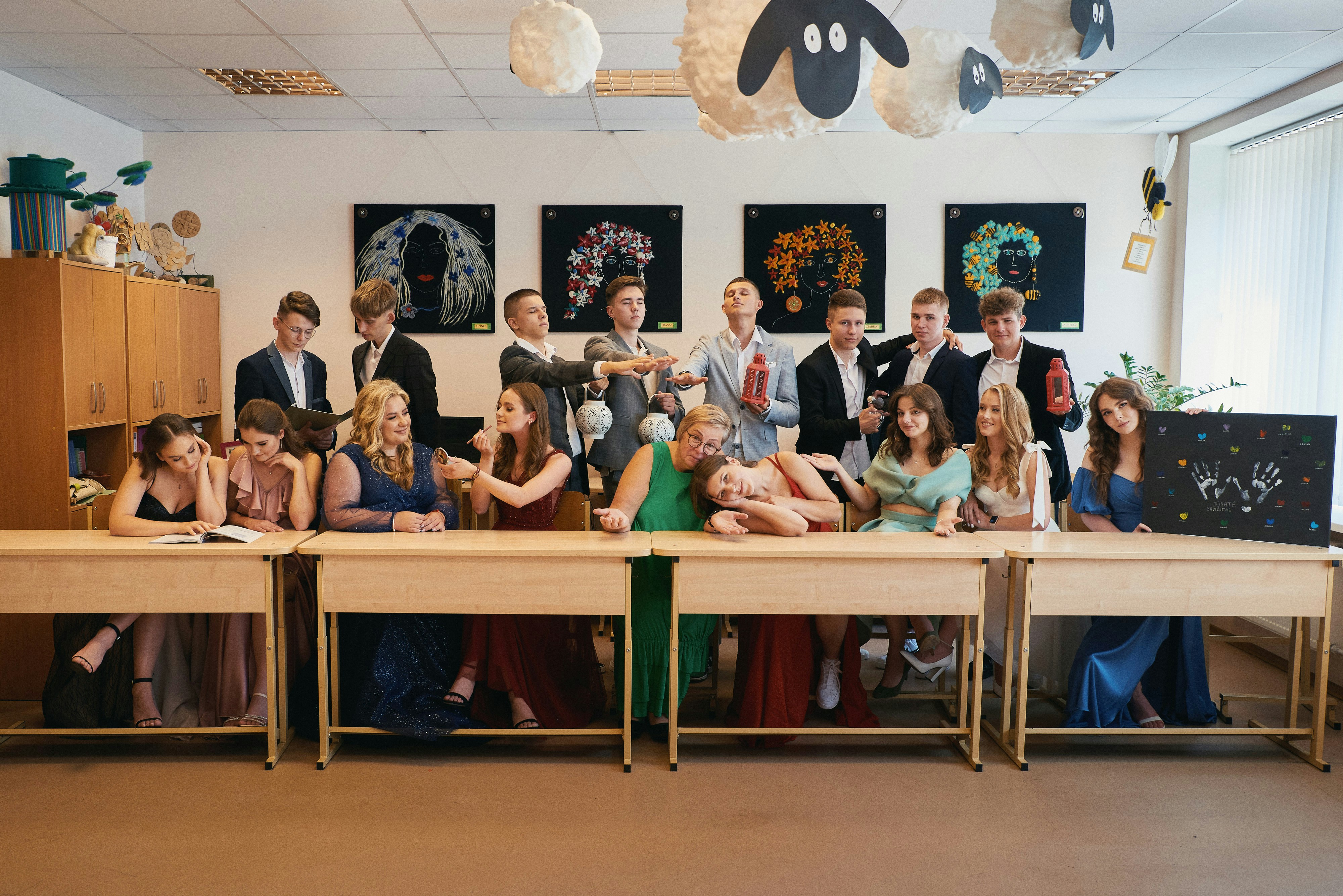 a group of people sitting at a long table