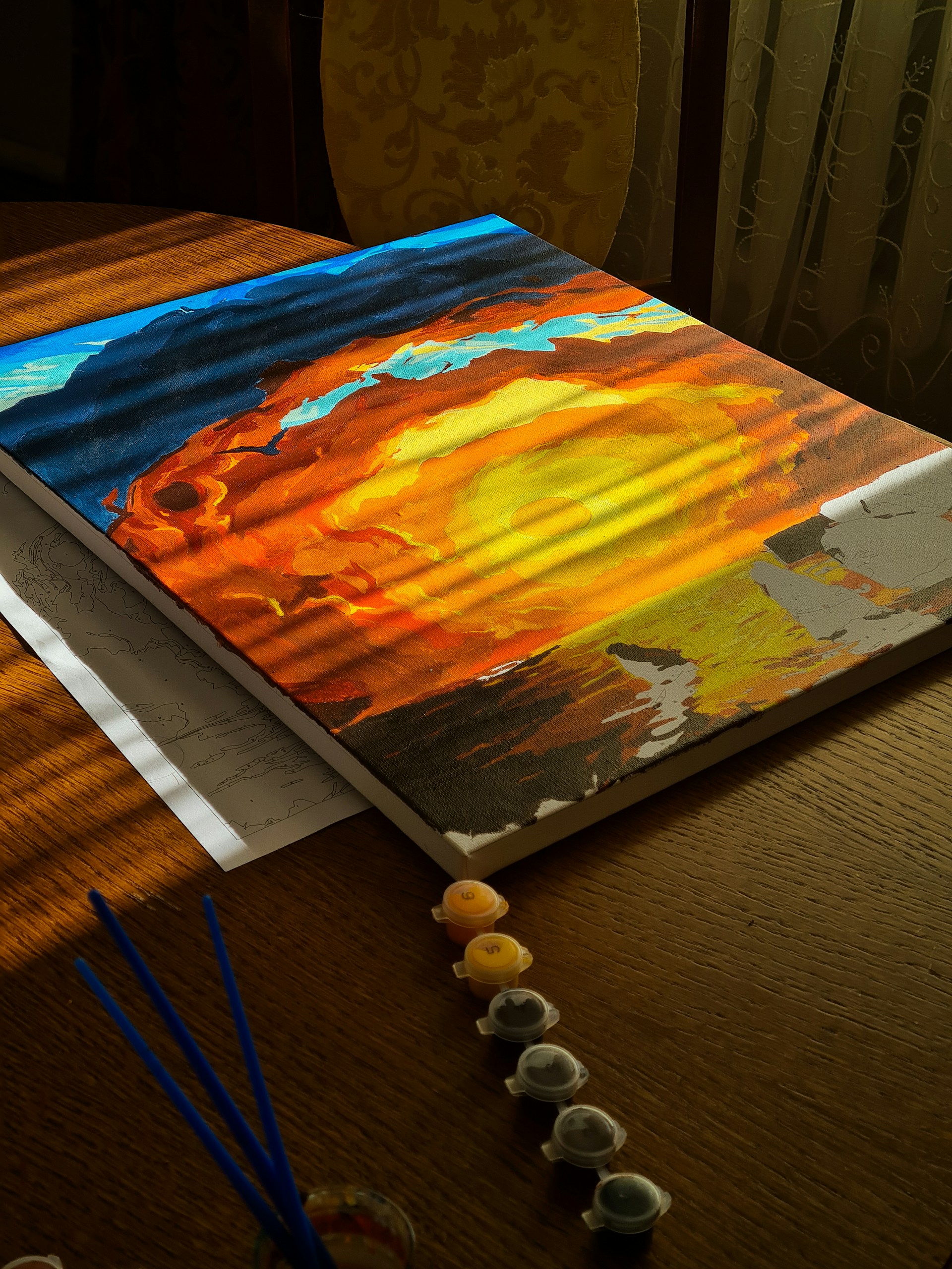 woman wearing yellow long-sleeved dress under white clouds and blue sky during daytime