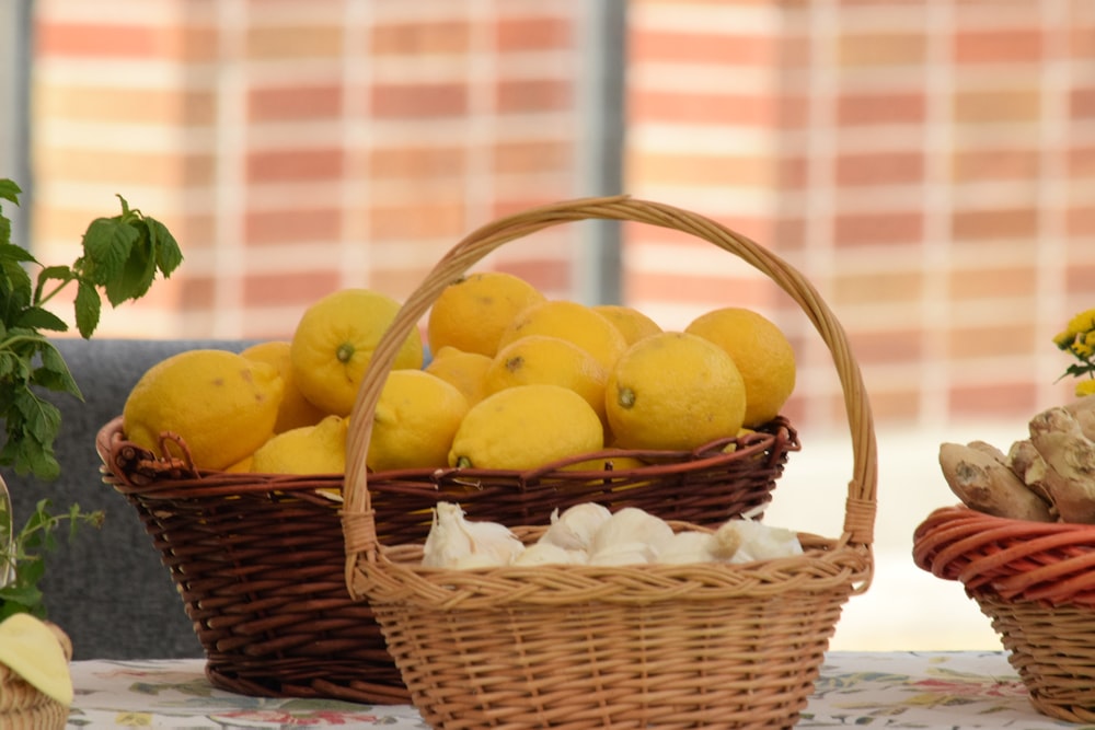a table topped with baskets filled with lemons