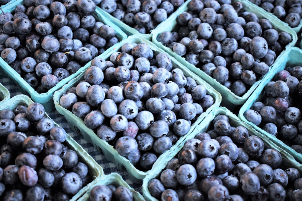 a pile of blueberries sitting on top of a table