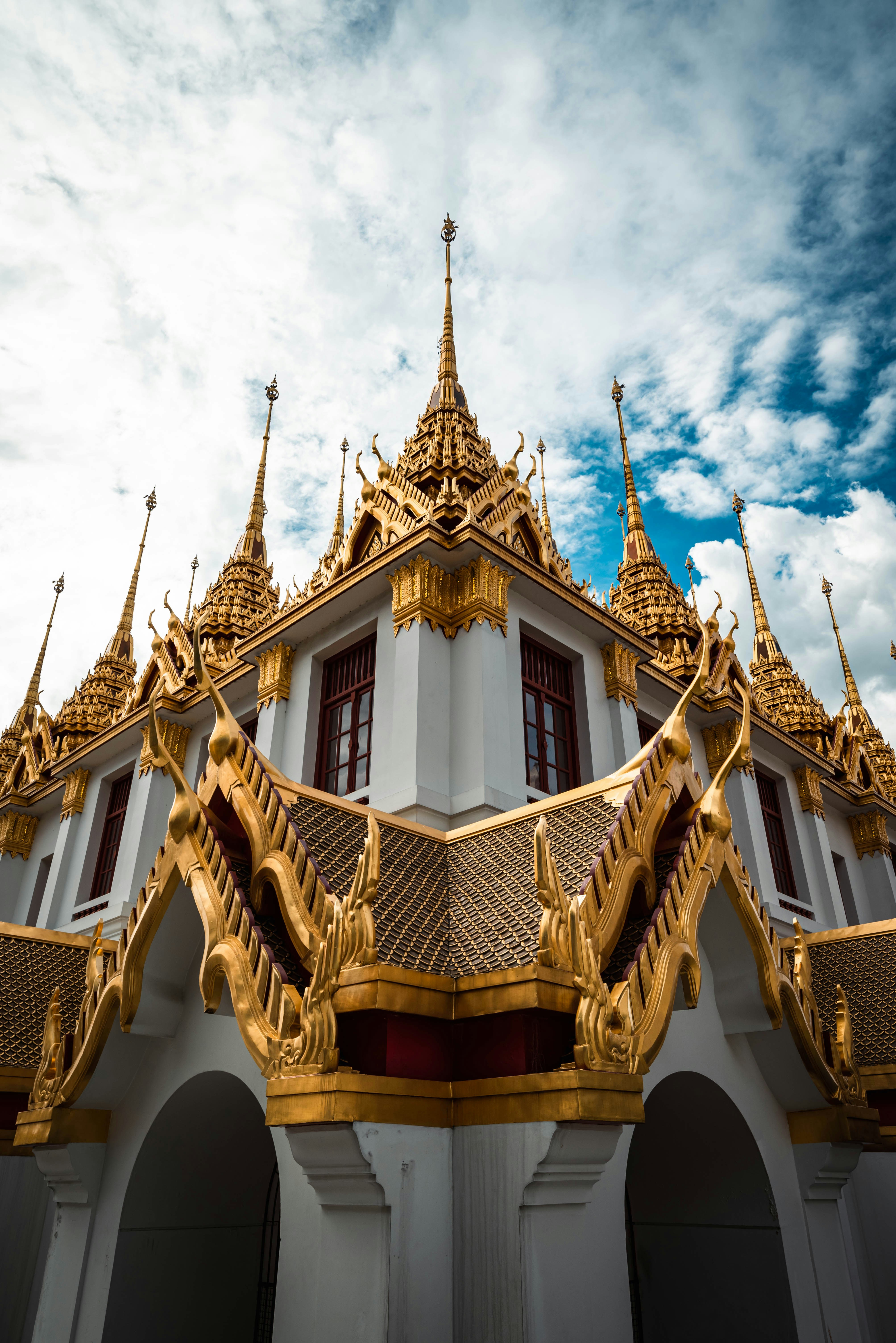 a white and gold building with a sky background