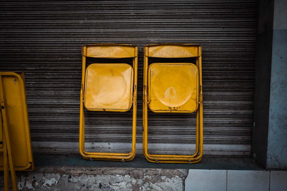 a couple of yellow chairs sitting next to each other