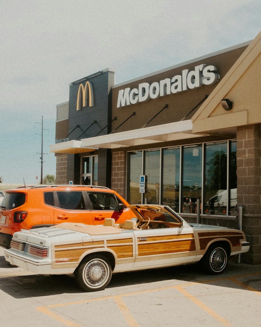 a mcdonald's car parked in front of a mcdonald's