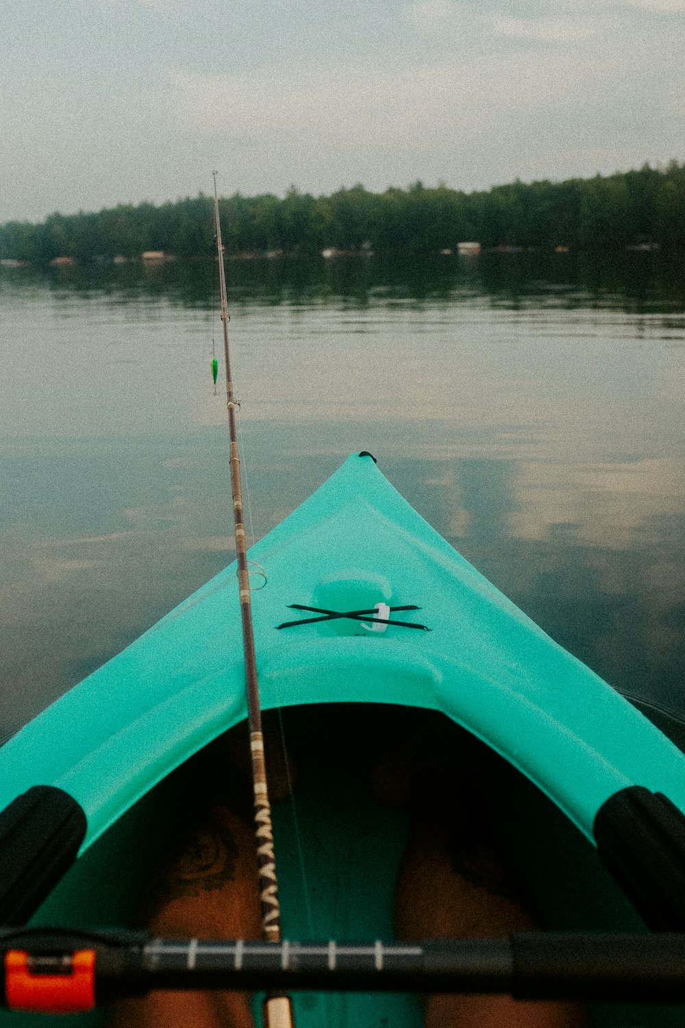 a person in a kayak with a fishing pole