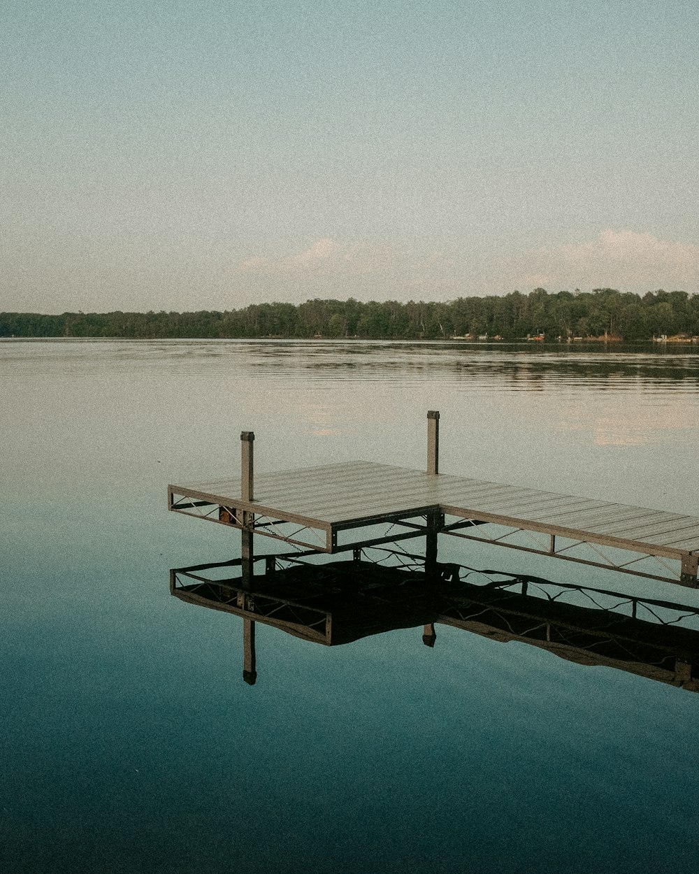 a dock sits in the middle of a lake