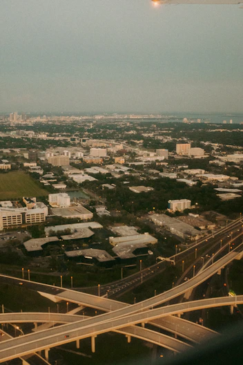 an aerial view of a highway and a city