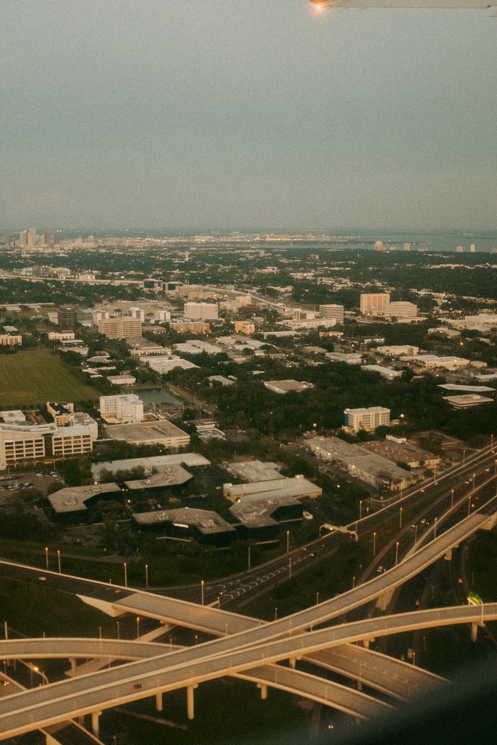 an aerial view of a highway and a city